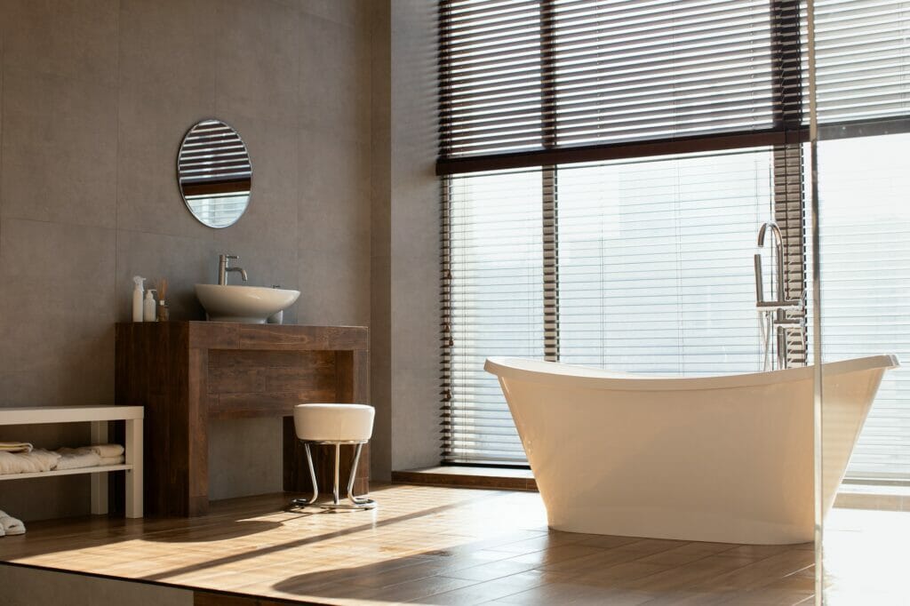 Modern bathroom with panoramic window in luxury apartment